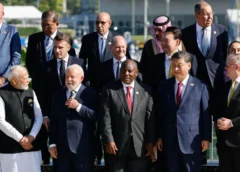 G20 leaders take group shot without Biden